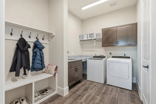 a view of closet with wooden floor