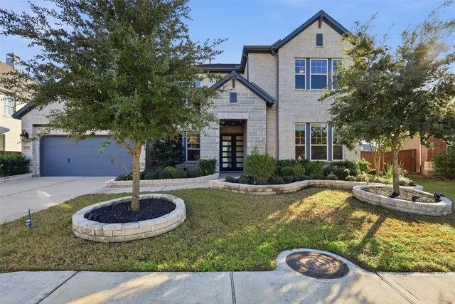a view of a house with backyard swimming pool and sitting area