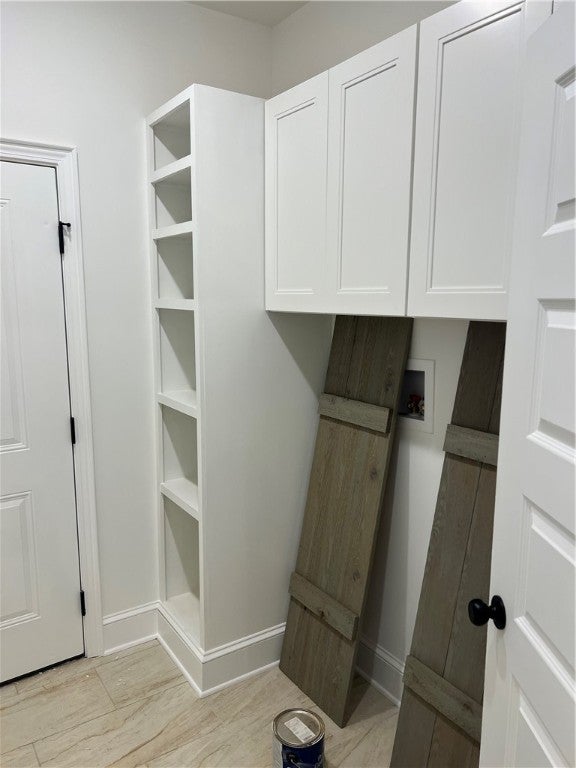 2525 Rocky Brook Road Opelika, AL 36801 - Photo 18 of 26 Laundry room also has custom storage those are the stained shutters that will be on the front