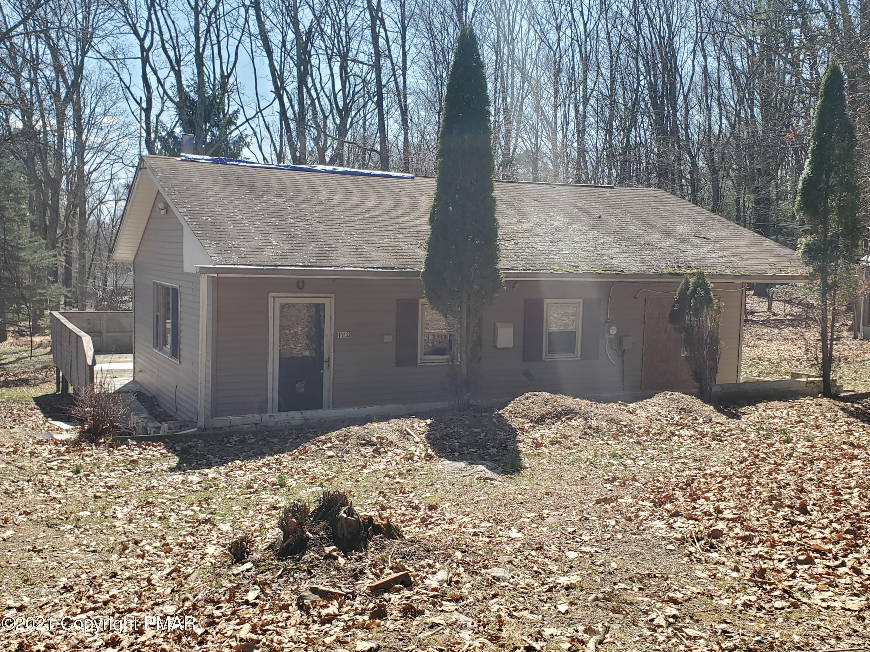 1112 Fir Road Effort, PA 18330 - Photo 2 of 8 a front view of a house with a yard