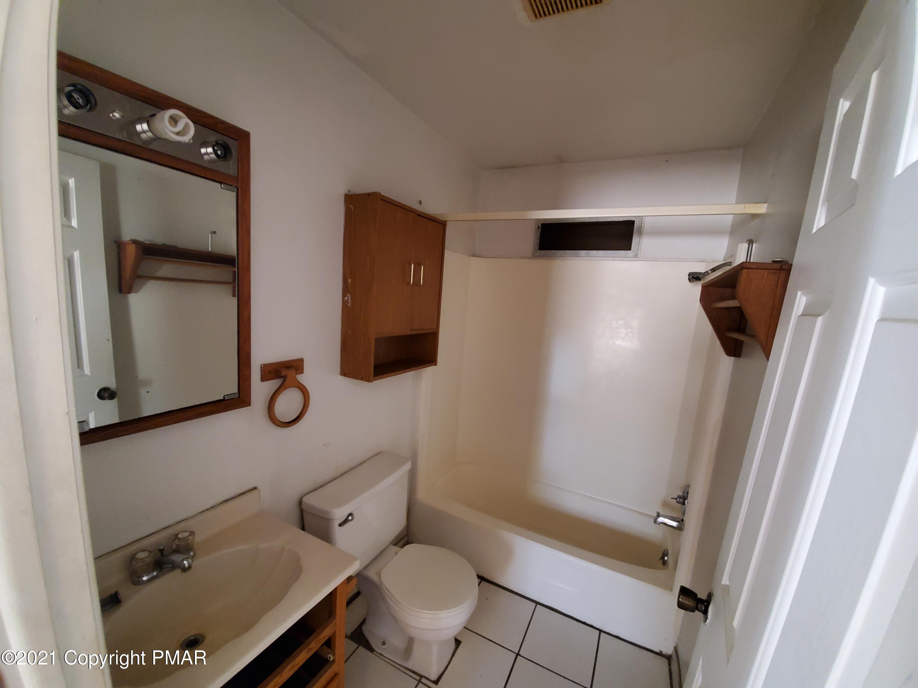 1112 Fir Road Effort, PA 18330 - Photo 8 of 8 a bathroom with a toilet sink and shower