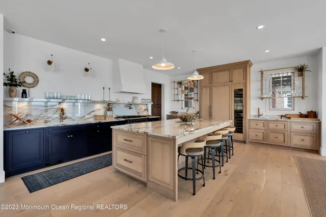 a kitchen with stainless steel appliances granite countertop a stove and a microwave