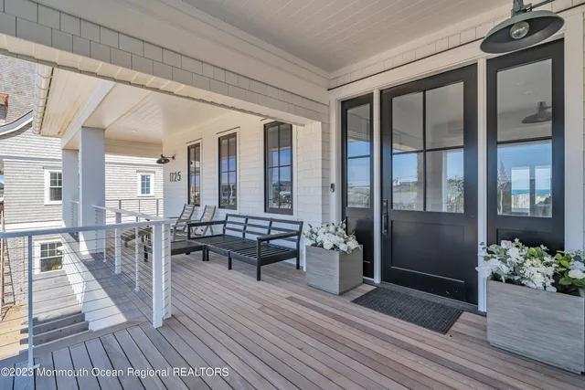 a view of a balcony with wooden floor