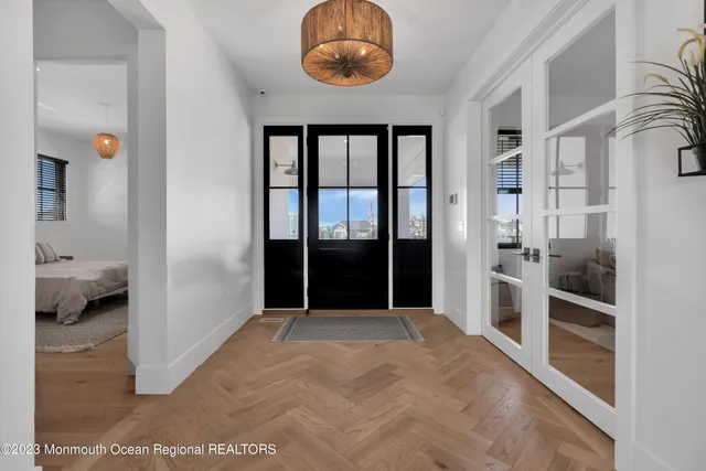 a living room with furniture a fireplace and a potted plant