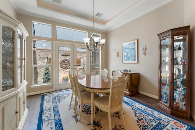 a living room with furniture a fireplace and a large window