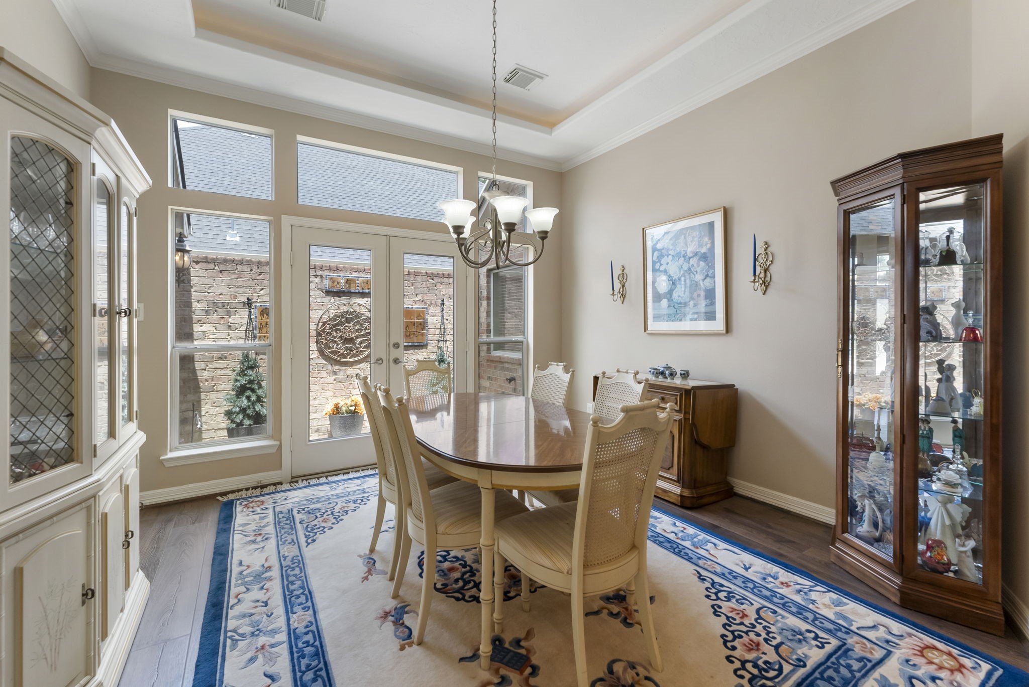 25514 Long Iron Court Spring, TX 77389 - Photo 13 of 38 a view of a dining room with furniture wooden floor and a chandelier
