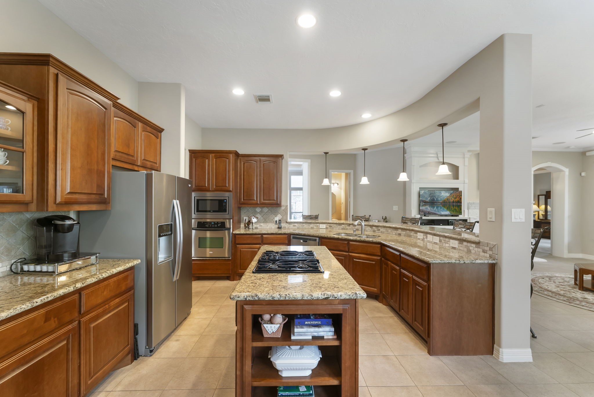 25514 Long Iron Court Spring, TX 77389 - Photo 16 of 38 The gourmet kitchen opens to the family room offering abundant counter space and cabinetry.