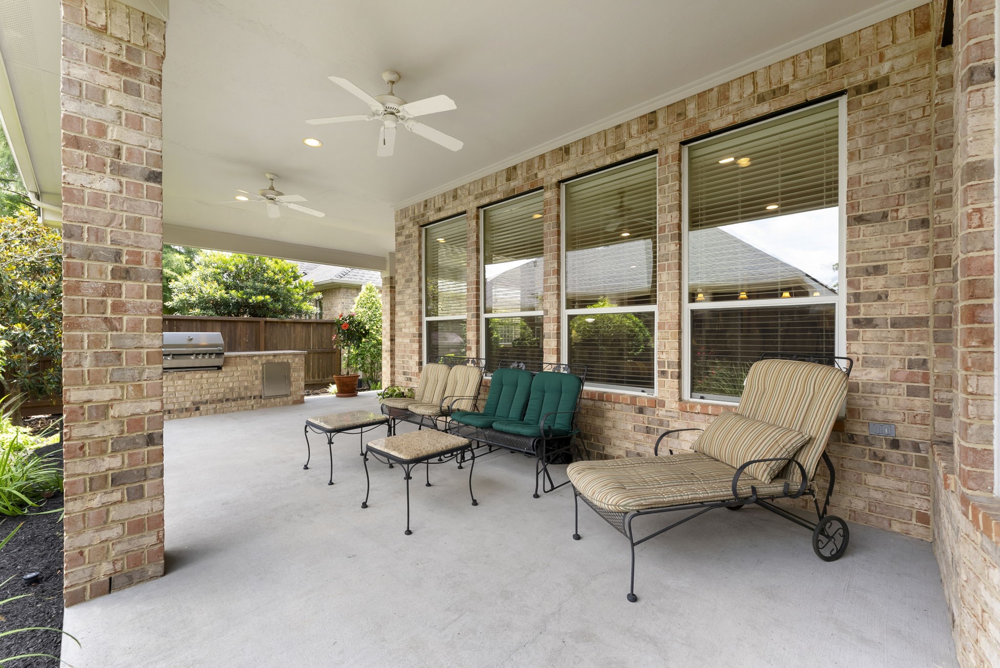 25514 Long Iron Court Spring, TX 77389 - Photo 30 of 38 a outdoor living space with furniture and a large window
