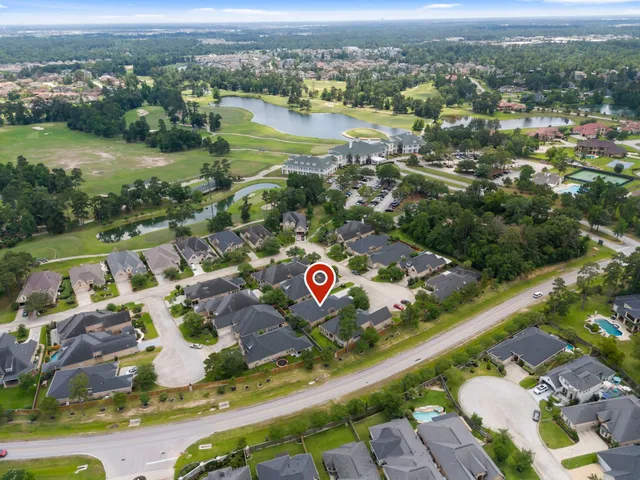 an aerial view of residential house with outdoor space and lake view