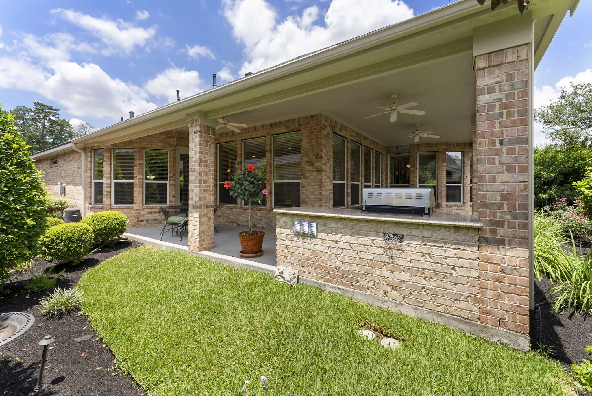 25514 Long Iron Court Spring, TX 77389 - Photo 31 of 38 a view of a house with backyard porch and sitting area