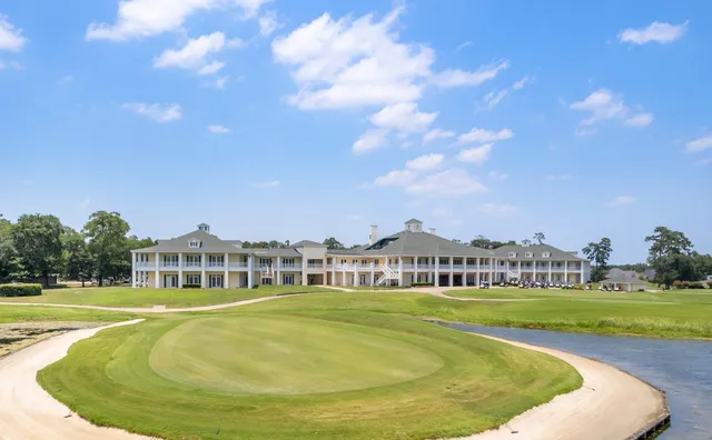 a view of a swimming pool with a yard