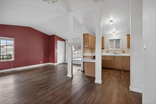a kitchen with stainless steel appliances a sink and a refrigerator
