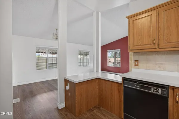 a kitchen with stainless steel appliances granite countertop a stove and a refrigerator