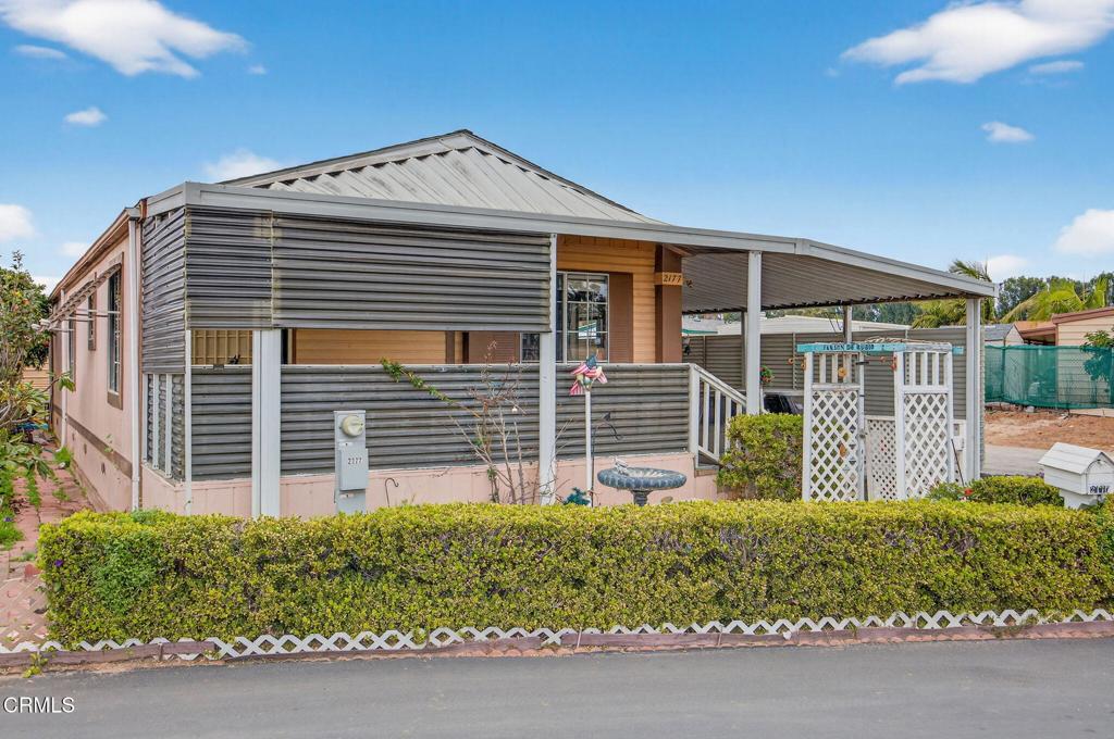 2177 Robin Avenue, Unit 2177A Oxnard, CA 93033 - Photo 3 of 28 a front view of a house with a garden