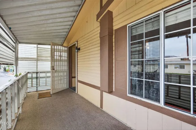 a view of a balcony with window