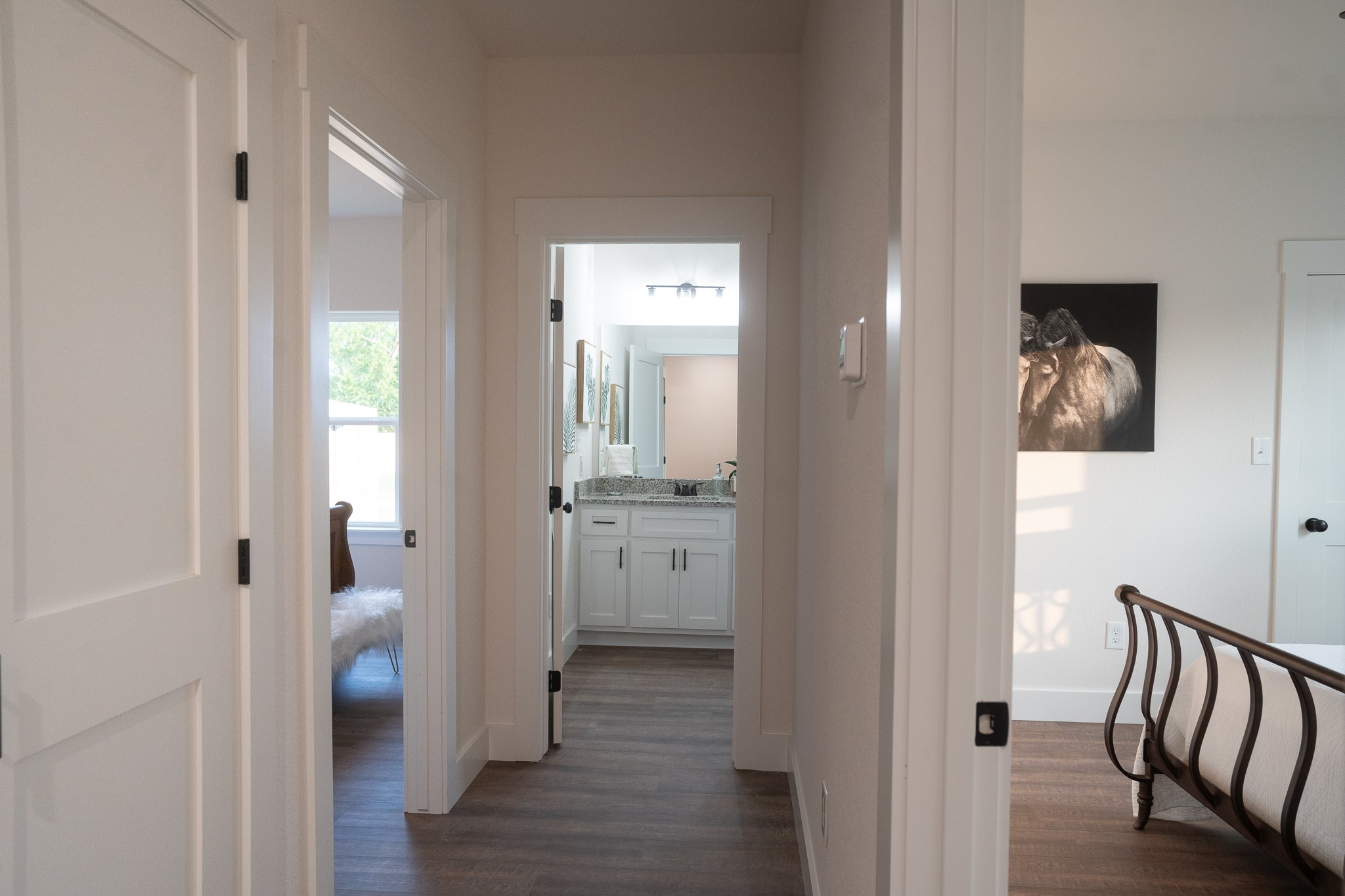 304 String Prairie Way Smithville, TX 78957 - Photo 26 of 30 Corridor with dark wood-style flooring, a sink, and baseboards