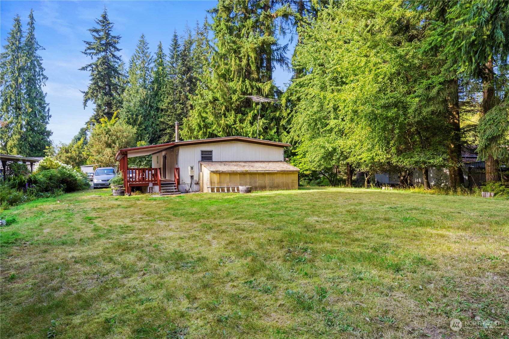 383 Dungeness Meadows Sequim, WA 98382 - Photo 17 of 30 a view of a big yard with plants and large trees
