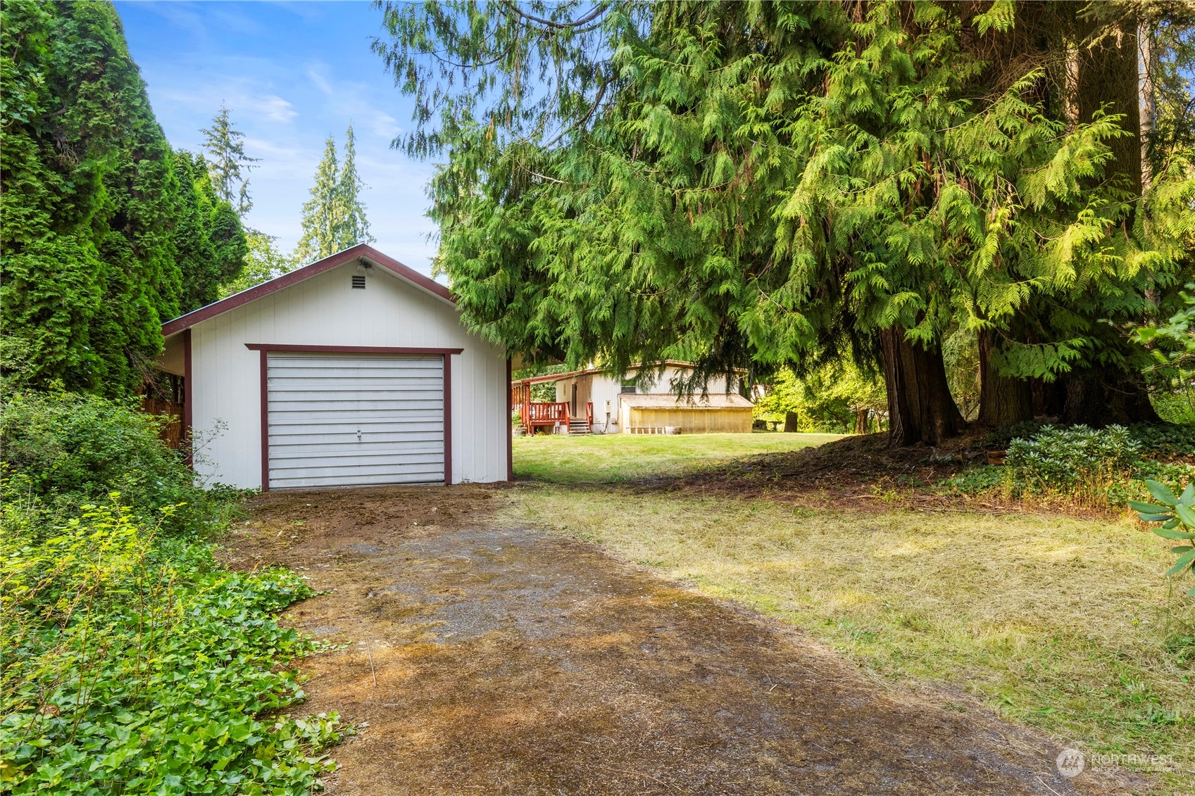 383 Dungeness Meadows Sequim, WA 98382 - Photo 21 of 30 a view of a house with a yard and garage