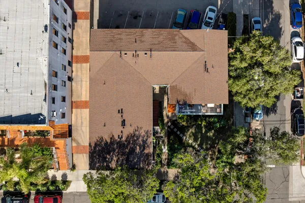 an aerial view of residential houses with outdoor space