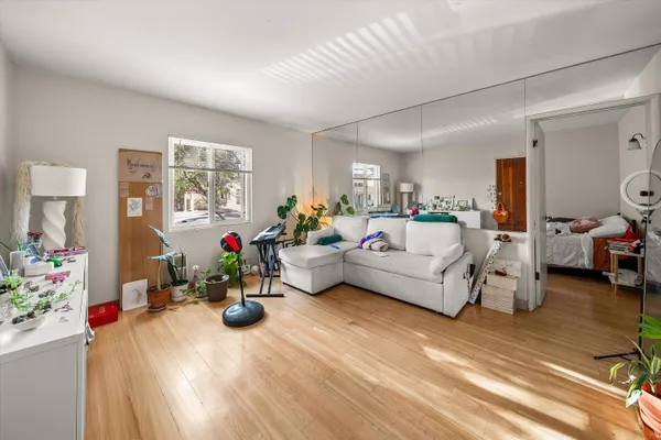 a living room with furniture and flowers