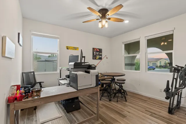 a view of a workspace with furniture and a workspace