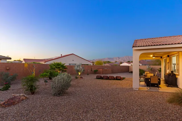 a terrace of a house with outdoor seating