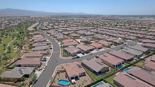an aerial view of a city with lots of residential buildings