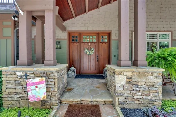 a view of entryway livingroom and hall with wooden floor