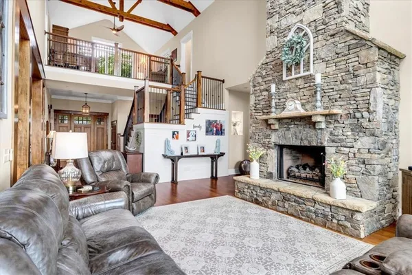 a view of a balcony with furniture and floor to ceiling window