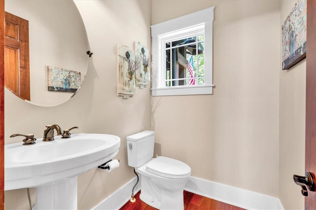 52 Waterside Drive Southeast Cartersville, GA 30121 - Photo 32 of 110 a white toilet sitting next to a bathroom sink