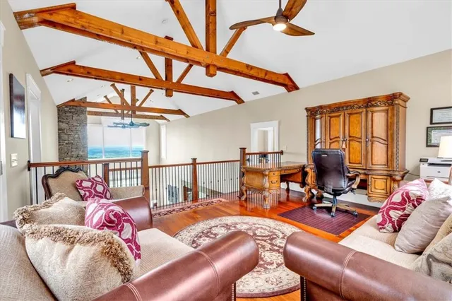 a view of a house with a yard and potted plants