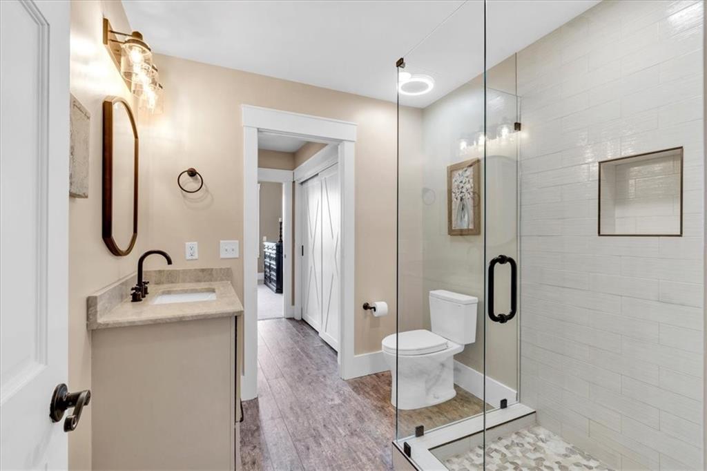 52 Waterside Drive Southeast Cartersville, GA 30121 - Photo 58 of 110 a bathroom with a sink a toilet and shower