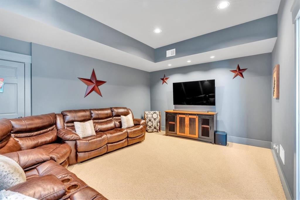 52 Waterside Drive Southeast Cartersville, GA 30121 - Photo 60 of 110 a living room with furniture and a flat screen tv
