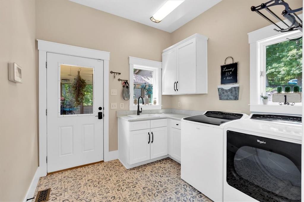 52 Waterside Drive Southeast Cartersville, GA 30121 - Photo 64 of 110 a kitchen with stainless steel appliances granite countertop a stove a sink and a refrigerator