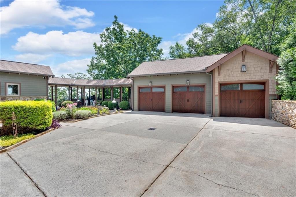 52 Waterside Drive Southeast Cartersville, GA 30121 - Photo 89 of 110 a view of a house with a yard and potted plants