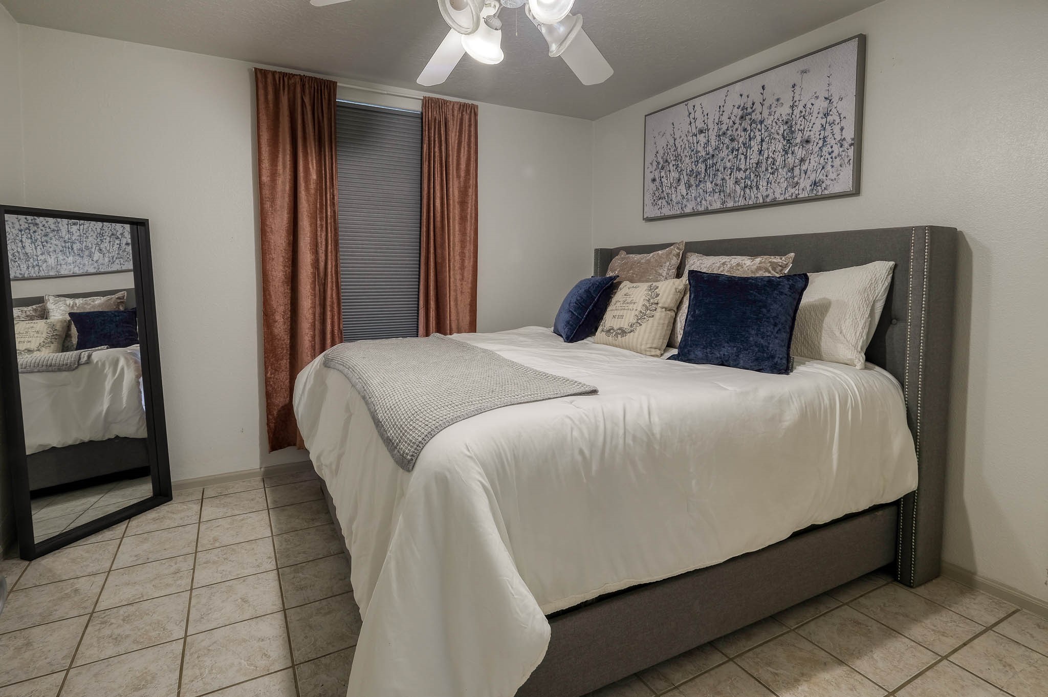 22474 Kmiec Road Hempstead, TX 77445 - Photo 41 of 49 a large bed sitting in a bedroom and a chandelier