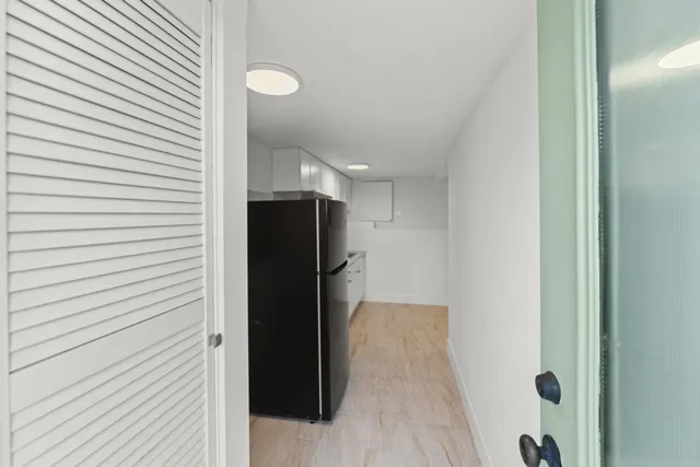 a view of hallway with walk in closet