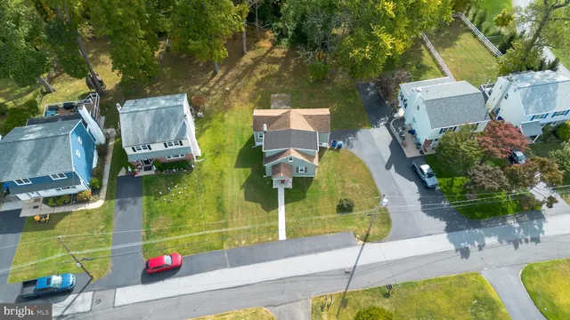 an aerial view of a house with swimming pool