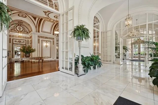 a view of an entryway with a chandelier