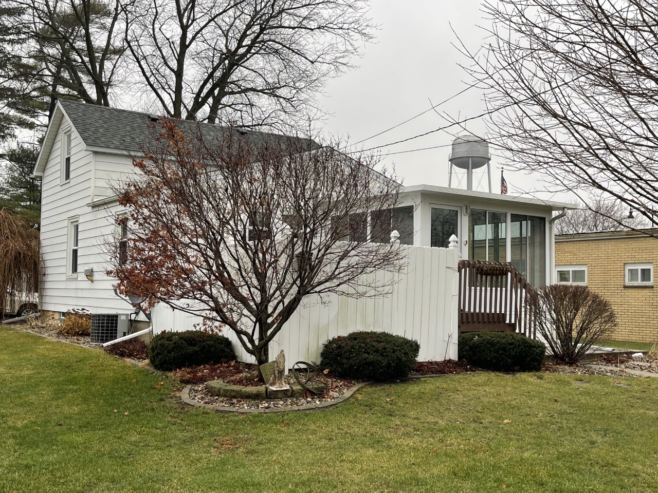 210 South Main Street Herscher, IL 60941 - Photo 19 of 23 a front view of a house with a yard and garage
