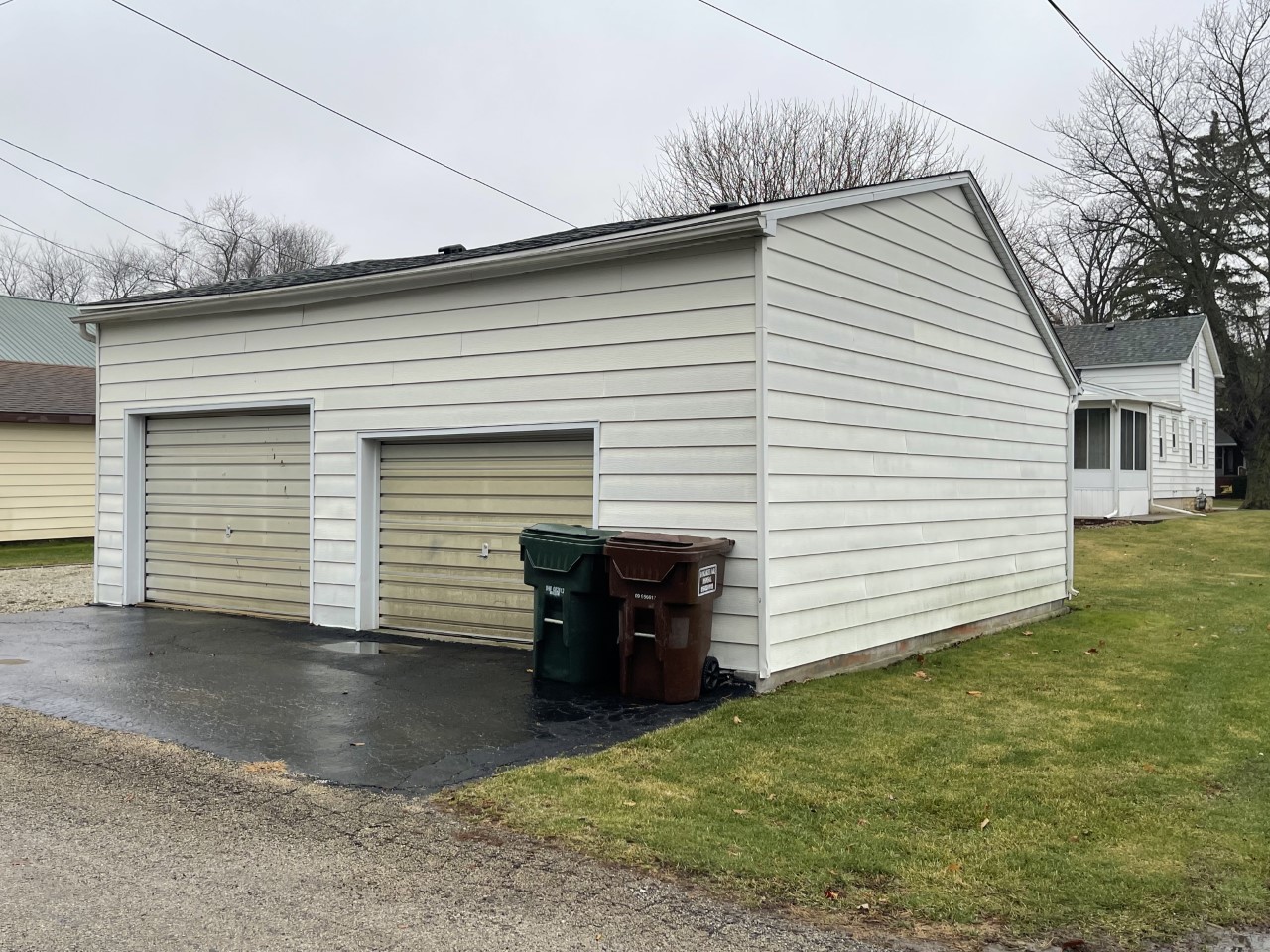 210 South Main Street Herscher, IL 60941 - Photo 22 of 23 a view of a white house with a small yard