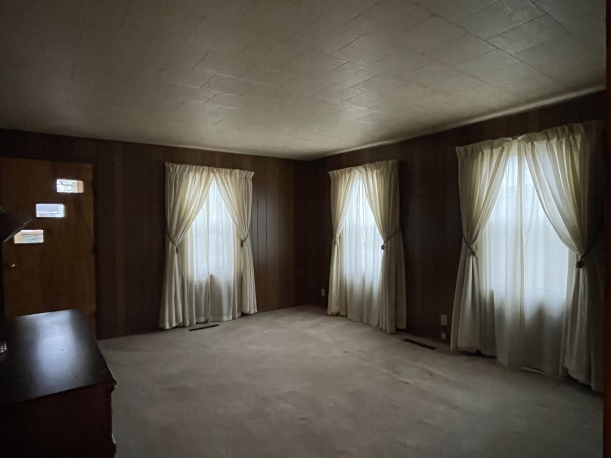 210 South Main Street Herscher, IL 60941 - Photo 4 of 23 an empty room with windows and closet area