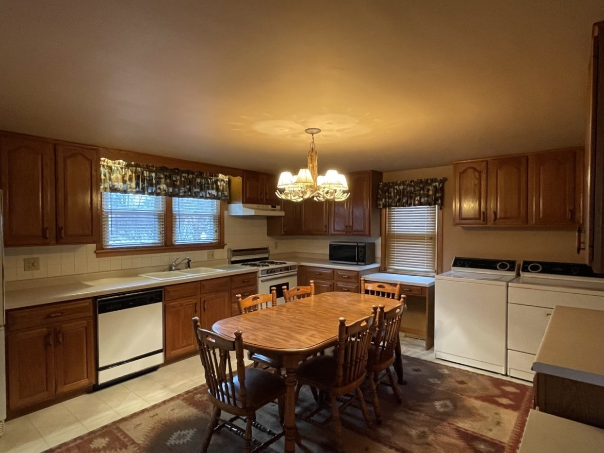 210 South Main Street Herscher, IL 60941 - Photo 7 of 23 a kitchen with a table and chairs in it
