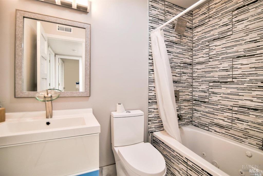22 Fairfax Street, Unit B San Rafael, CA 94901 - Photo 3 of 8 a bathroom with a sink a toilet and shower