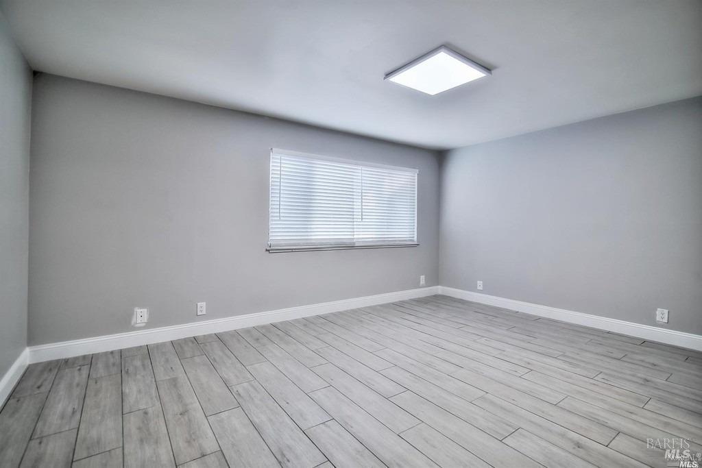 22 Fairfax Street, Unit B San Rafael, CA 94901 - Photo 6 of 8 wooden floor in an empty room with a window