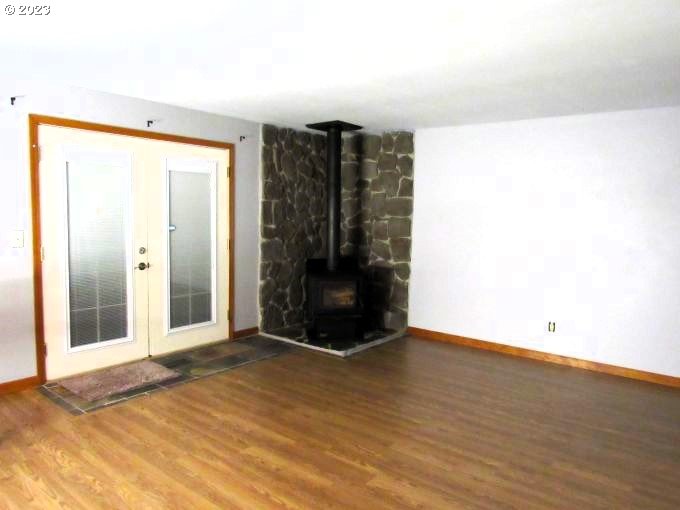 150 Southeast Palmblad Drive Gresham, OR 97080 - Photo 13 of 36 a view of an empty room with wooden floor and a window