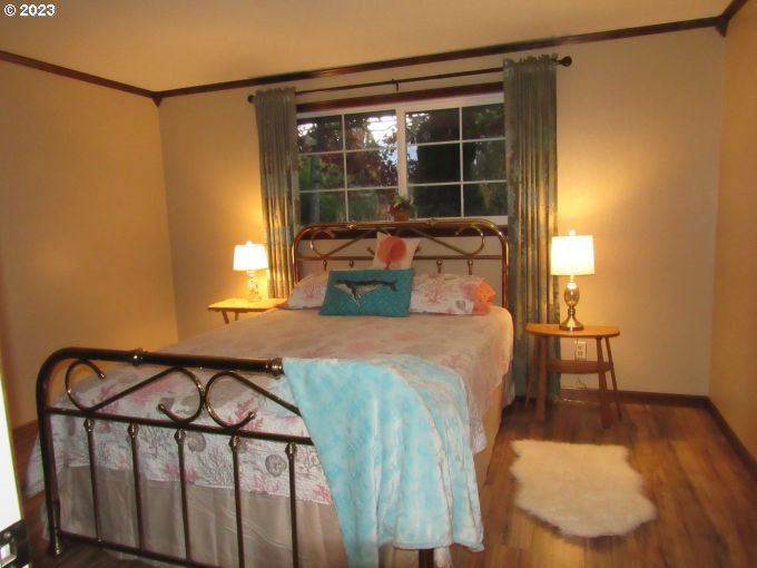 150 Southeast Palmblad Drive Gresham, OR 97080 - Photo 19 of 36 a bedroom with a bed window and a table in it