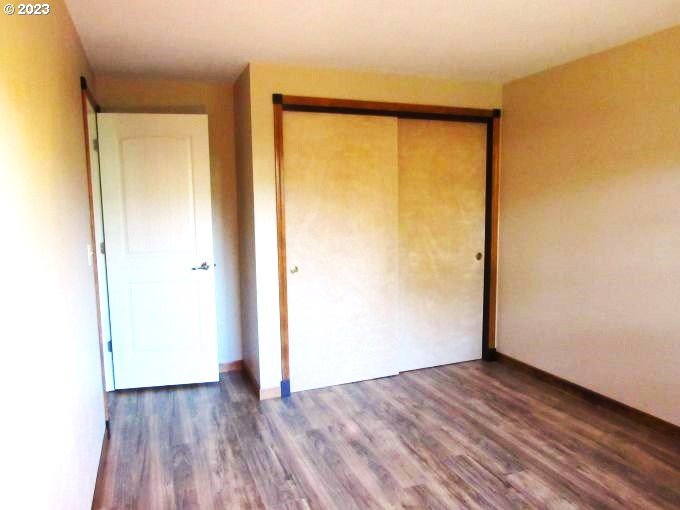 150 Southeast Palmblad Drive Gresham, OR 97080 - Photo 23 of 36 a view of an empty room with wooden floor and a window