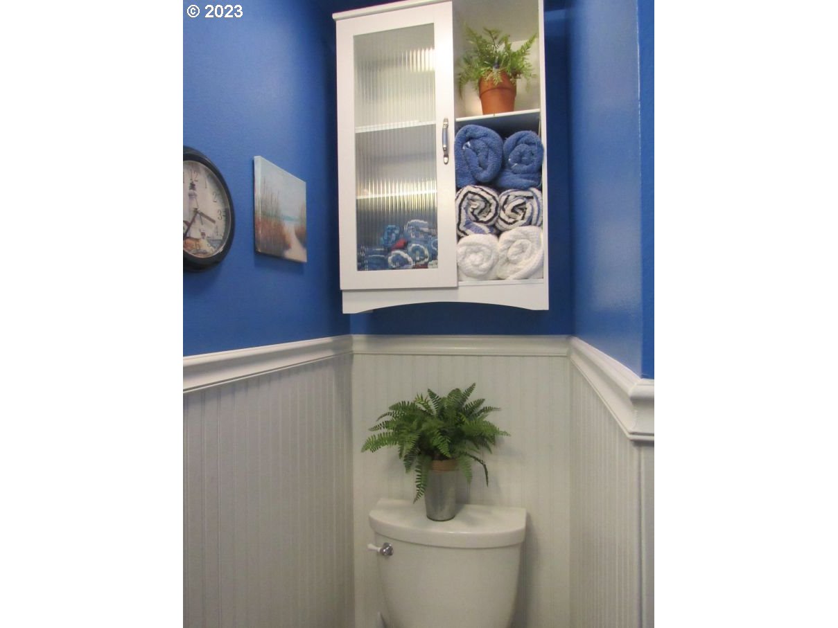 150 Southeast Palmblad Drive Gresham, OR 97080 - Photo 31 of 36 a bathroom with a toilet and a shower curtain