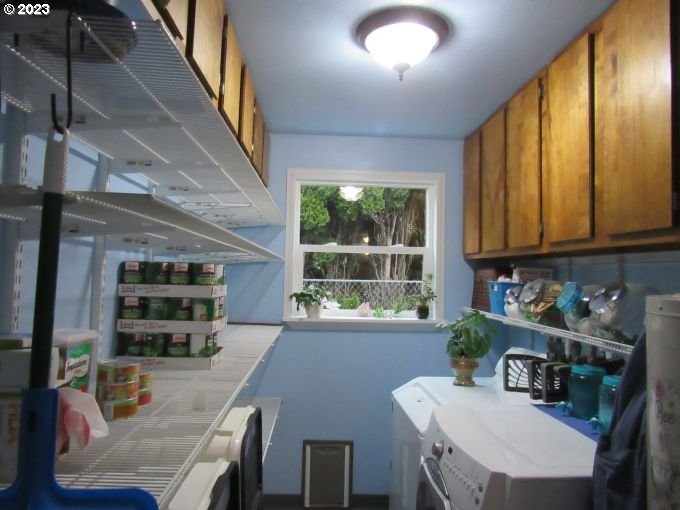 150 Southeast Palmblad Drive Gresham, OR 97080 - Photo 32 of 36 a kitchen with furniture a window and appliances